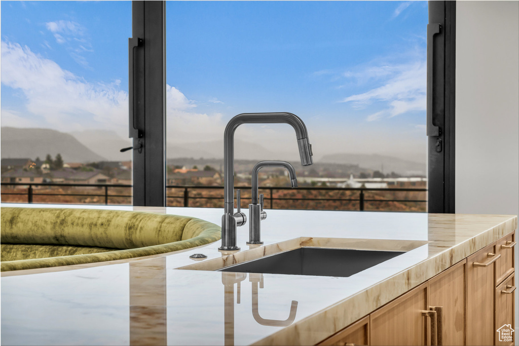 Kitchen view of a sink and mountains