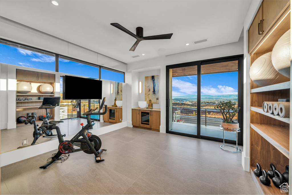 Workout area with ceiling fan and recessed lighting