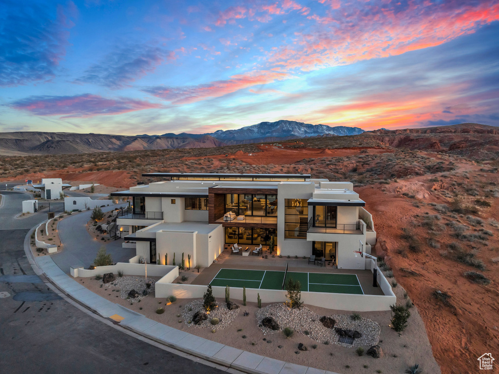 View from above of property with a mountain backdrop