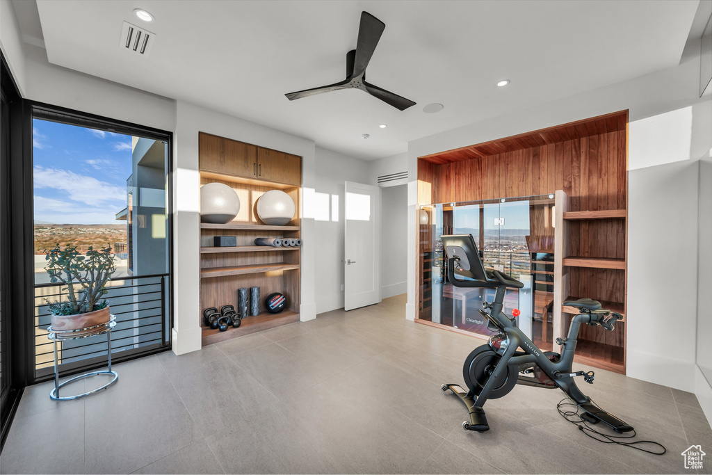 Exercise area featuring a ceiling fan and recessed lighting
