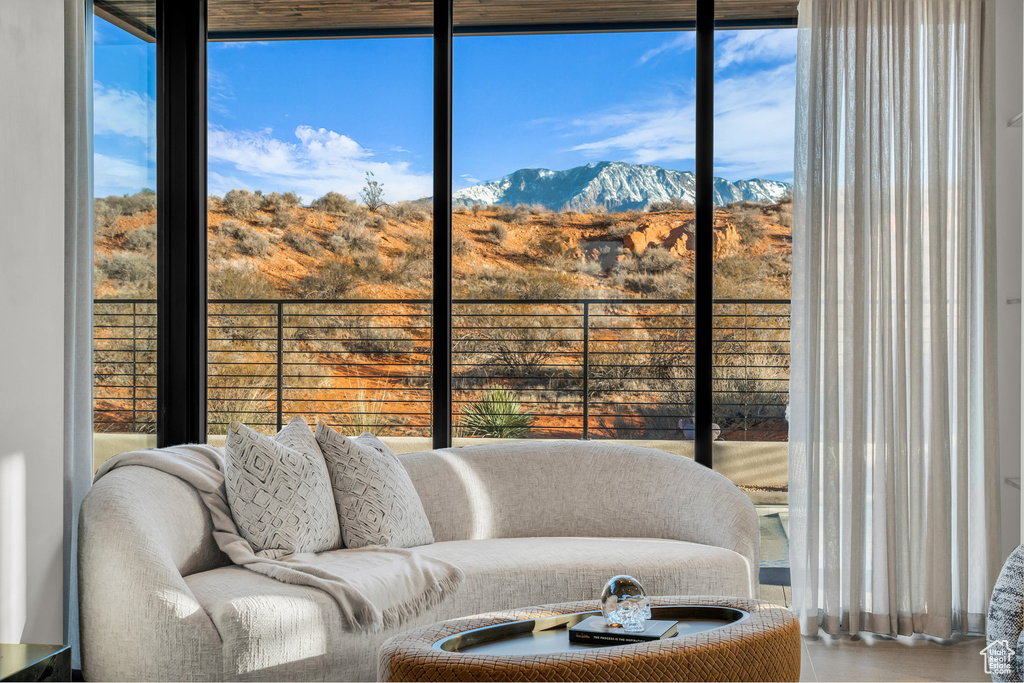 Living area featuring a mountain view and healthy amount of natural light