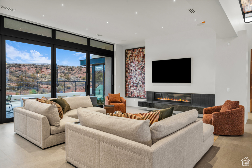 Living area with a fireplace and recessed lighting