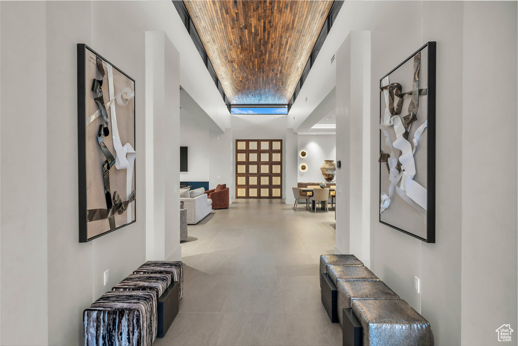 Hall with wooden ceiling and a tray ceiling