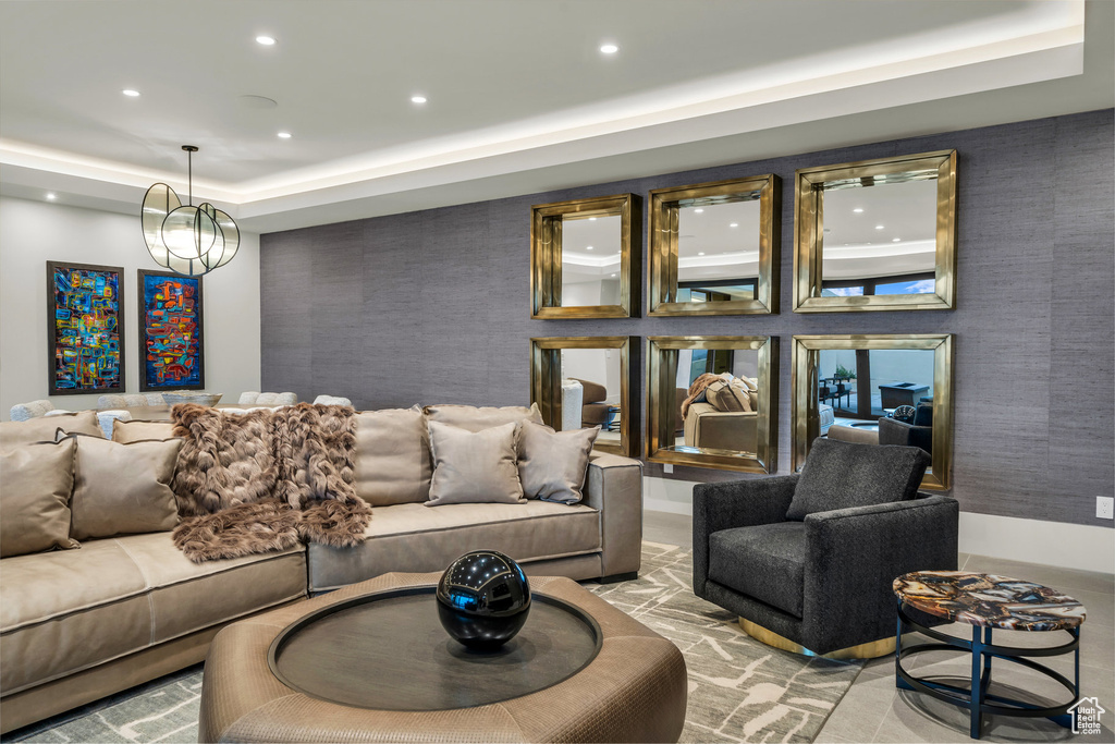 Living area with a tray ceiling and recessed lighting