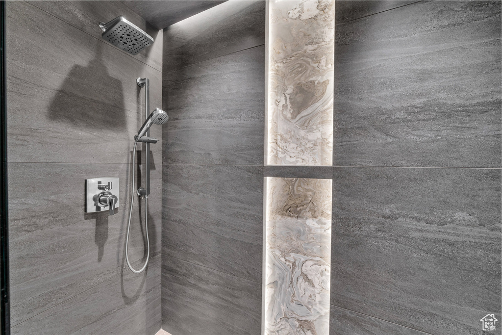 Full bathroom with tiled shower