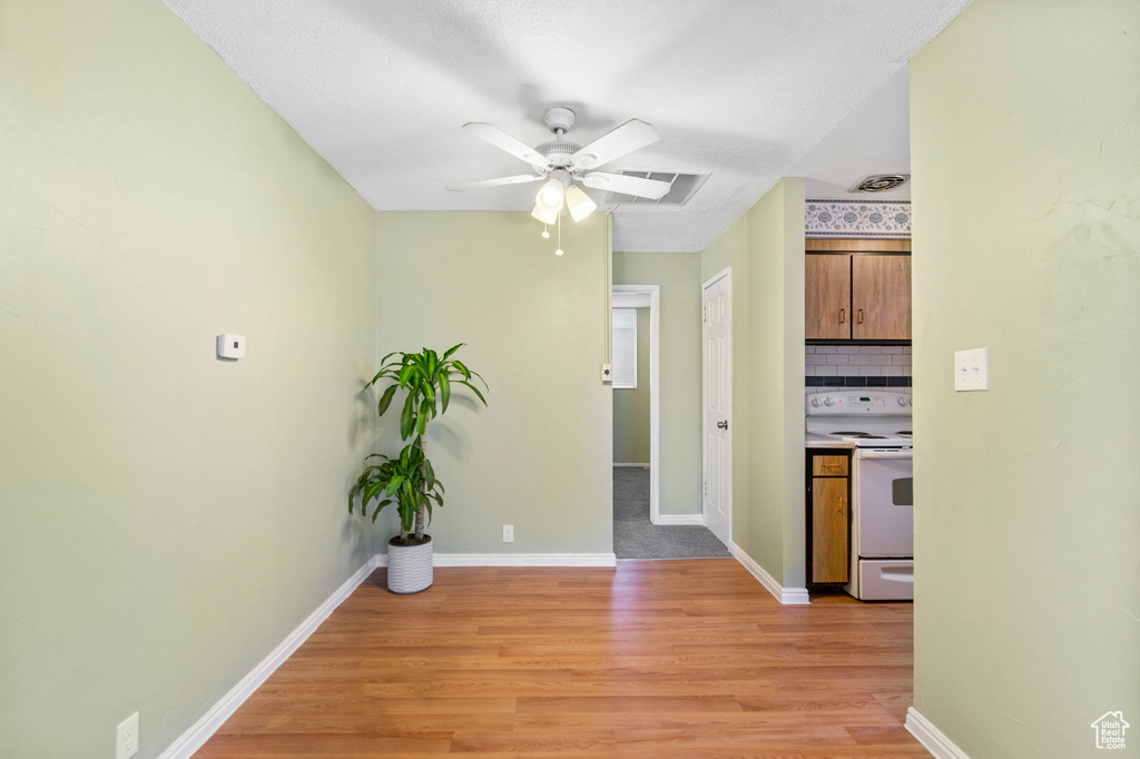 Hallway featuring light hardwood / wood-style flooring