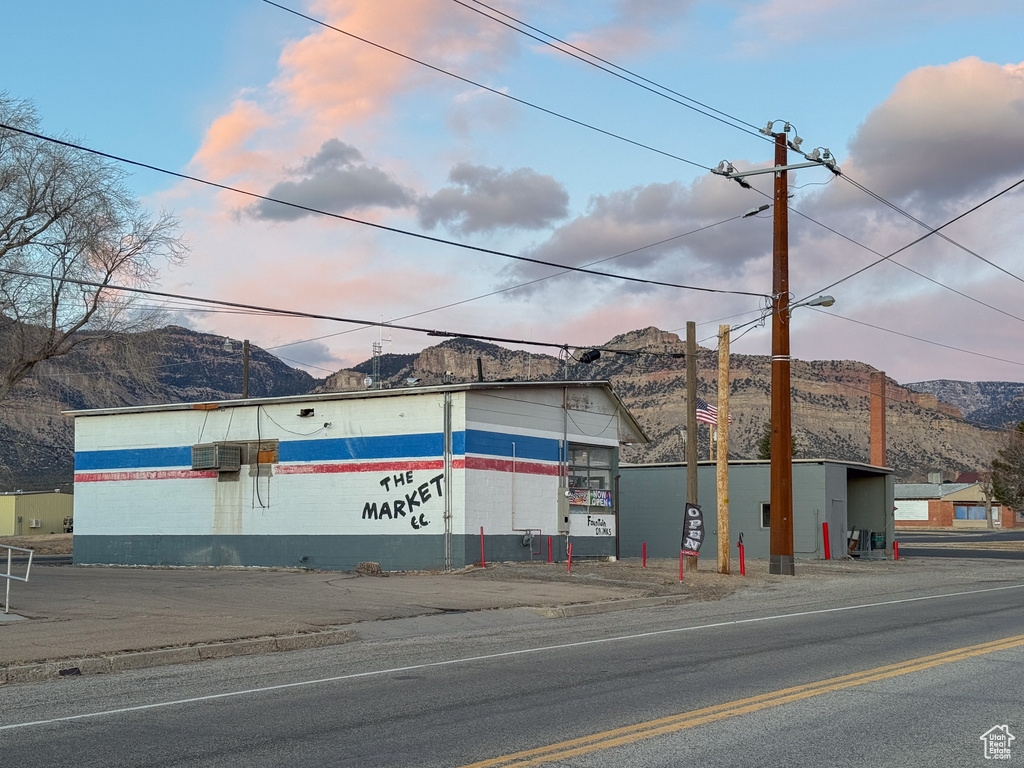 Outdoor building at dusk featuring a mountain view