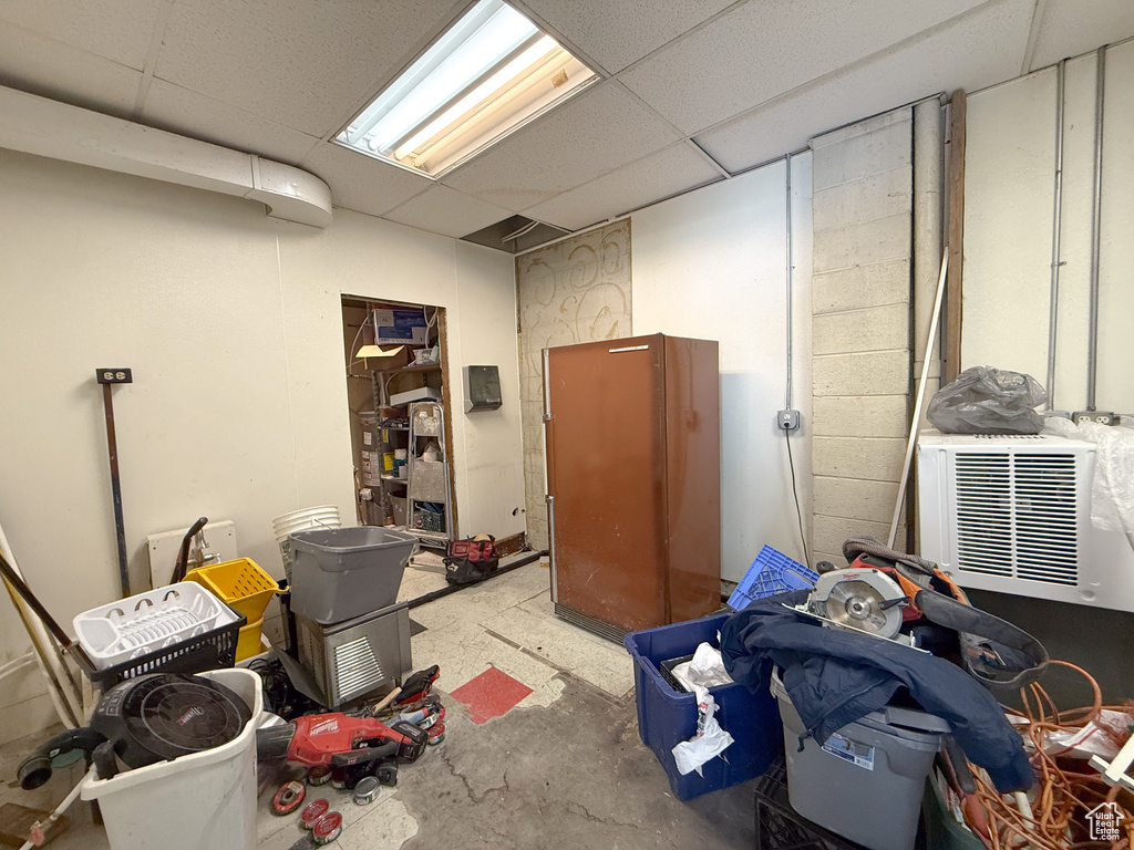 Basement with a paneled ceiling