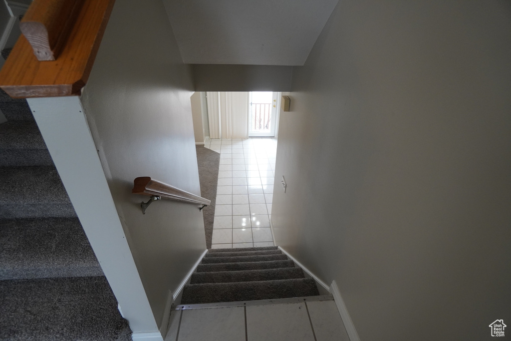 Stairway featuring tile patterned flooring