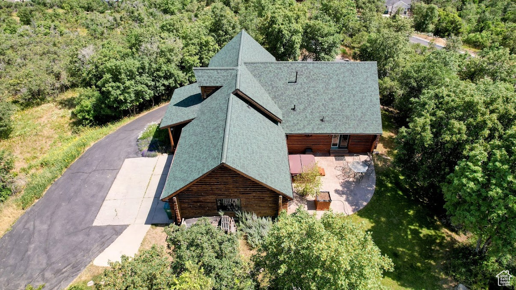 View of subject property featuring a heavily wooded area