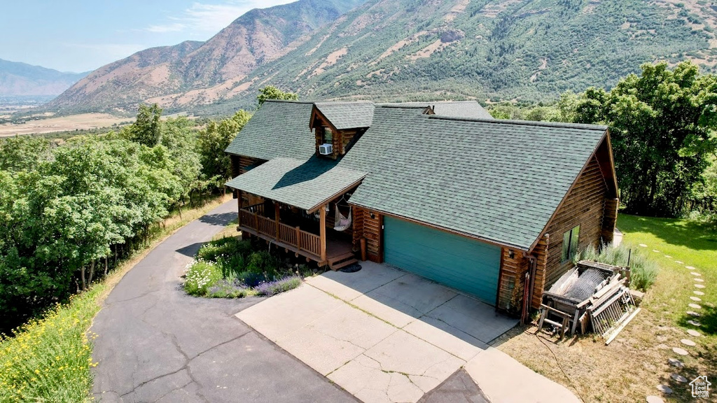 View of subject property featuring a mountainous background
