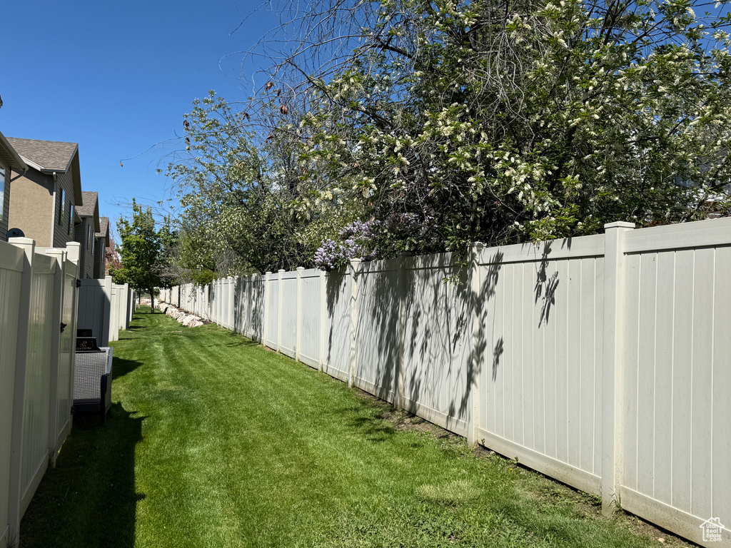 View of yard with a fenced backyard