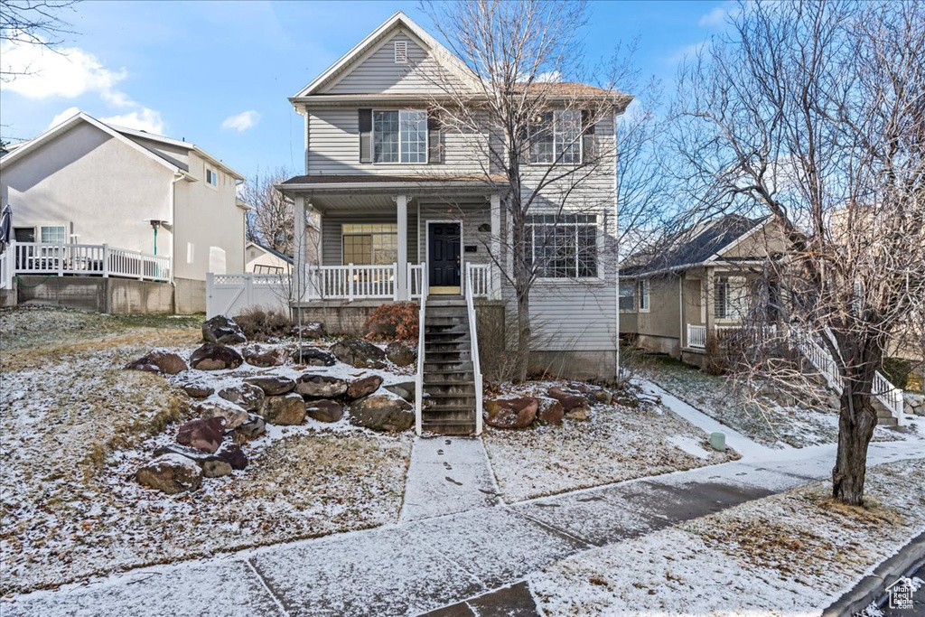 View of property with a porch