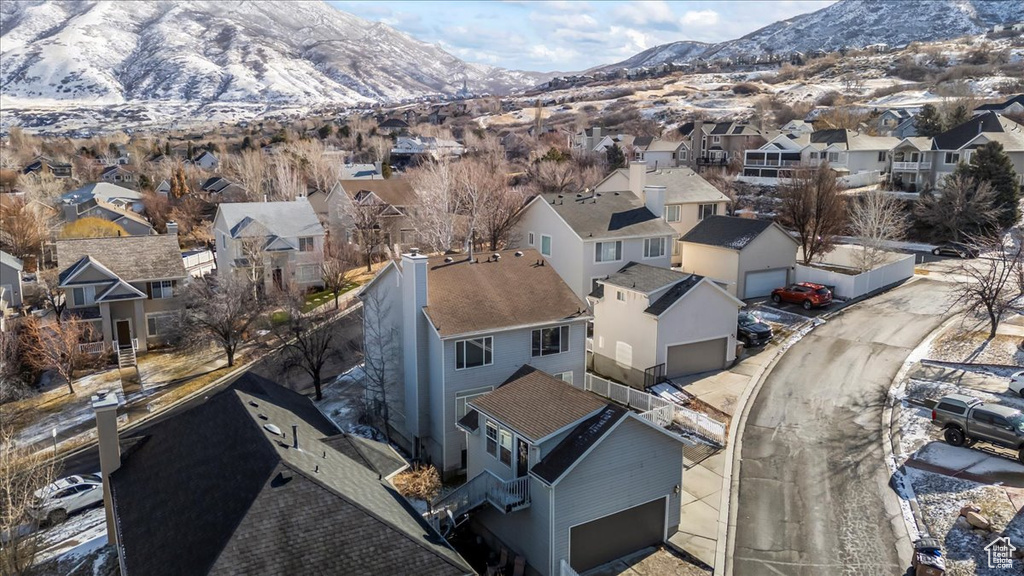 Snowy aerial view featuring a mountain view