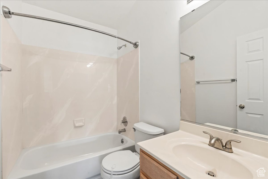Full bathroom featuring shower / bathing tub combination, vanity, and toilet