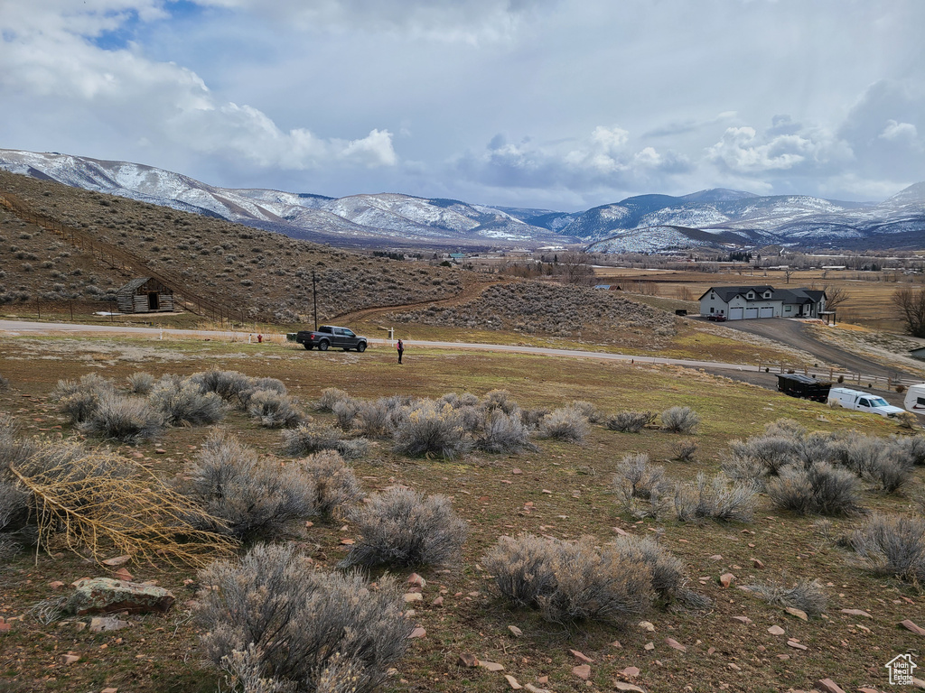 Property view of mountains with a rural view