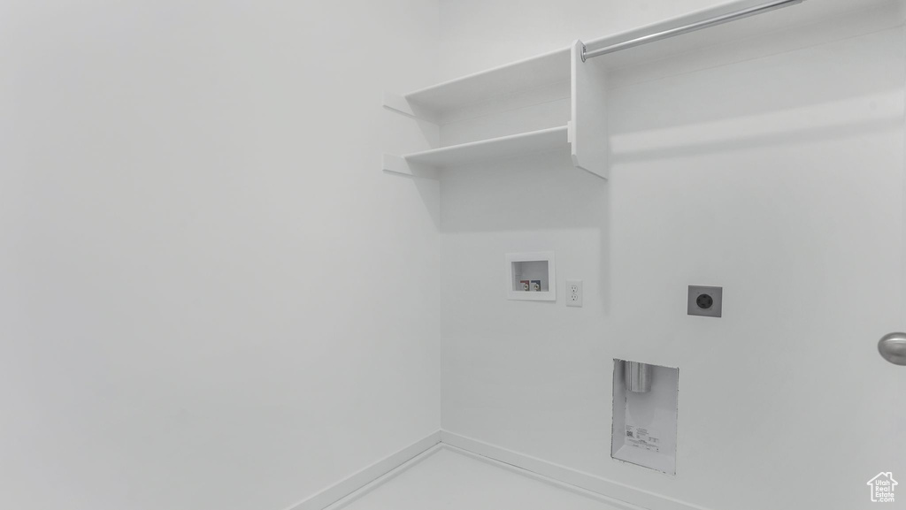 Laundry area featuring washer hookup, hookup for an electric dryer, and baseboards