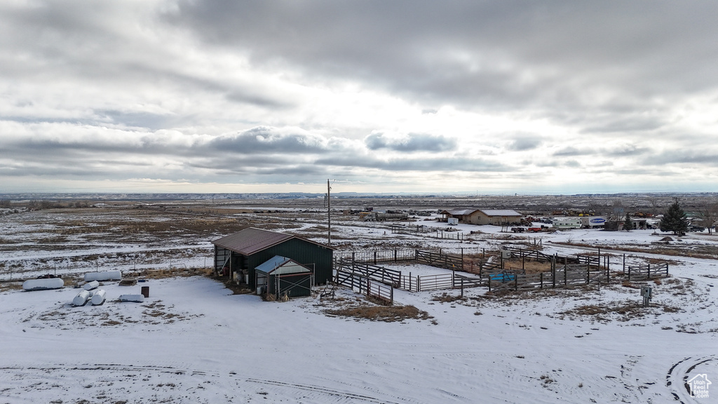 Snowy aerial view featuring a rural view