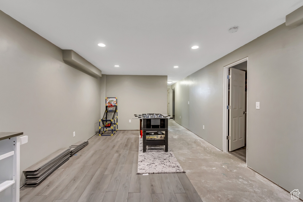 Exercise room featuring light hardwood / wood-style floors