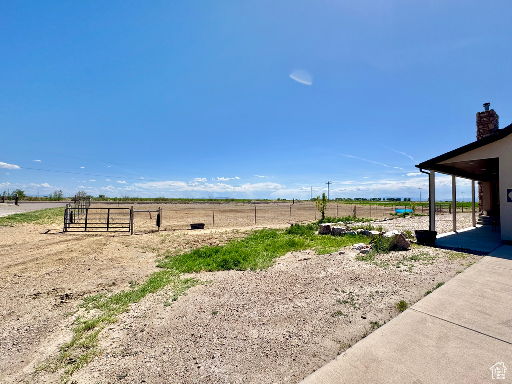 View of yard featuring a view of rural / pastoral area and a patio