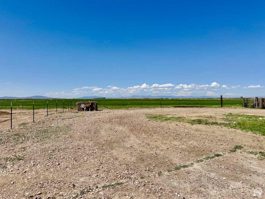 View of yard with a rural view