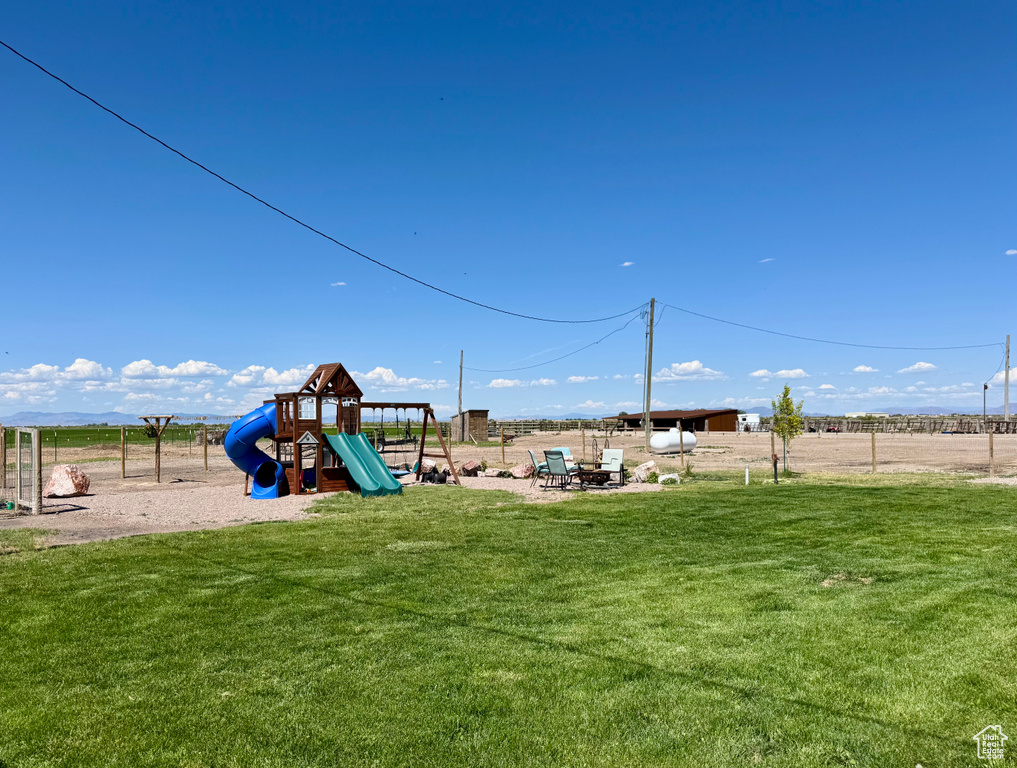 View of jungle gym with a yard