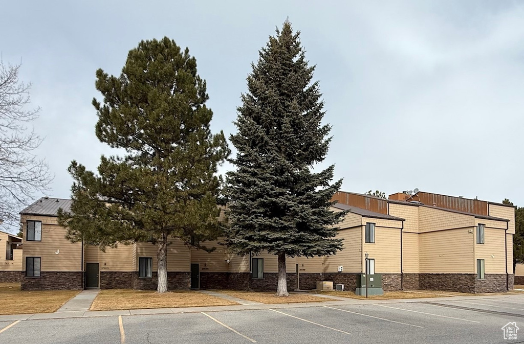 View of building exterior featuring central AC