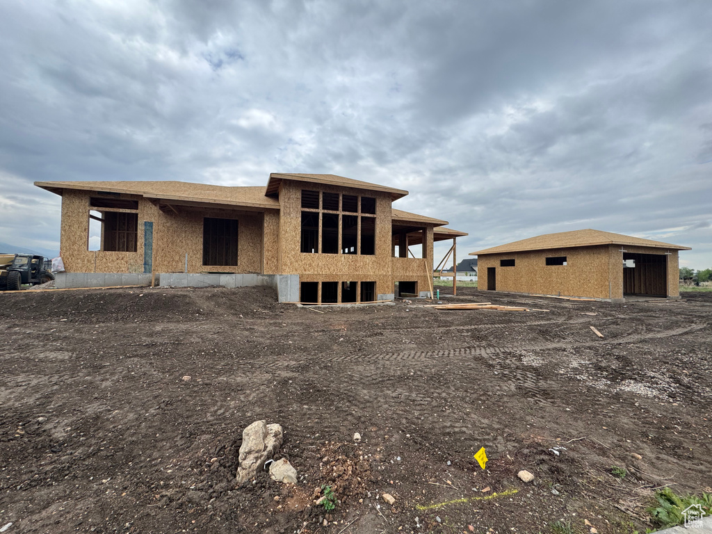 Rear view of property featuring a garage