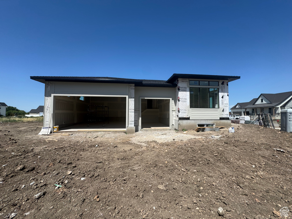 Property under construction with an attached garage