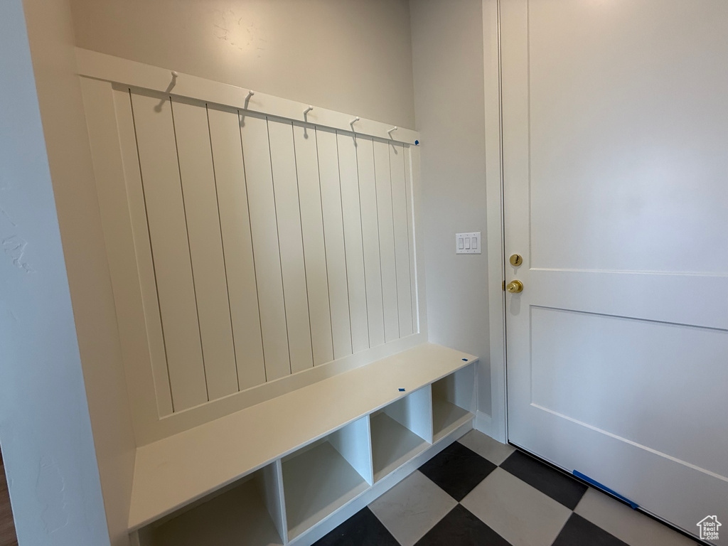 Mudroom with dark flooring