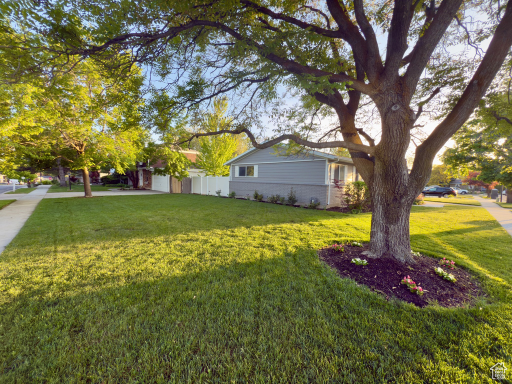 View of yard with a garage