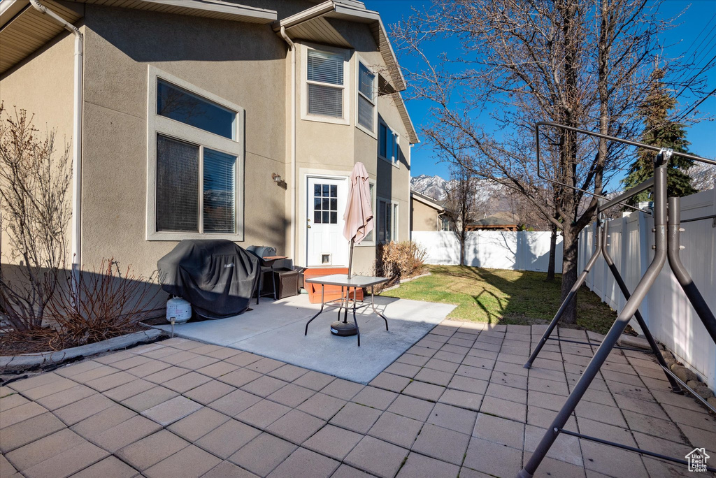 View of patio featuring area for grilling