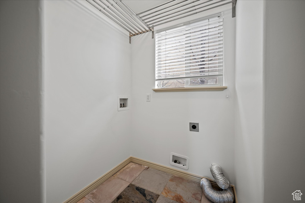 Laundry area with washer hookup and hookup for an electric dryer