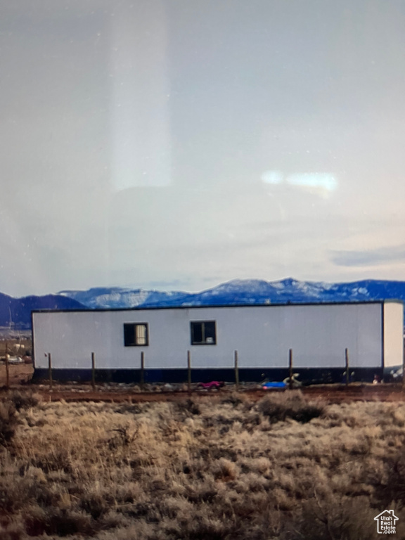 View of outbuilding with a mountain view