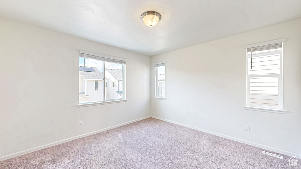 Empty room with carpet flooring