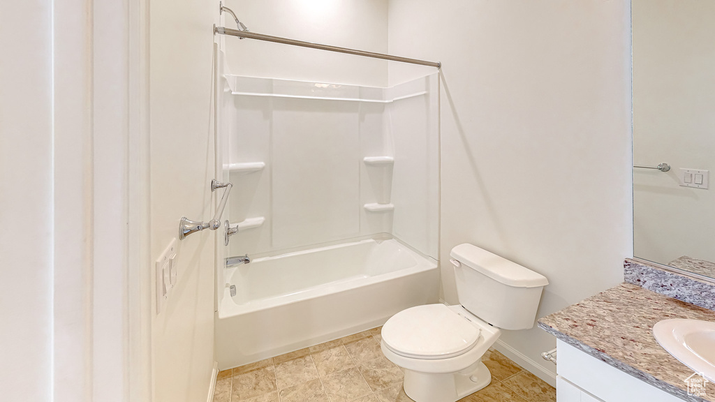 Full bathroom with vanity, toilet, bathing tub / shower combination, and tile patterned flooring