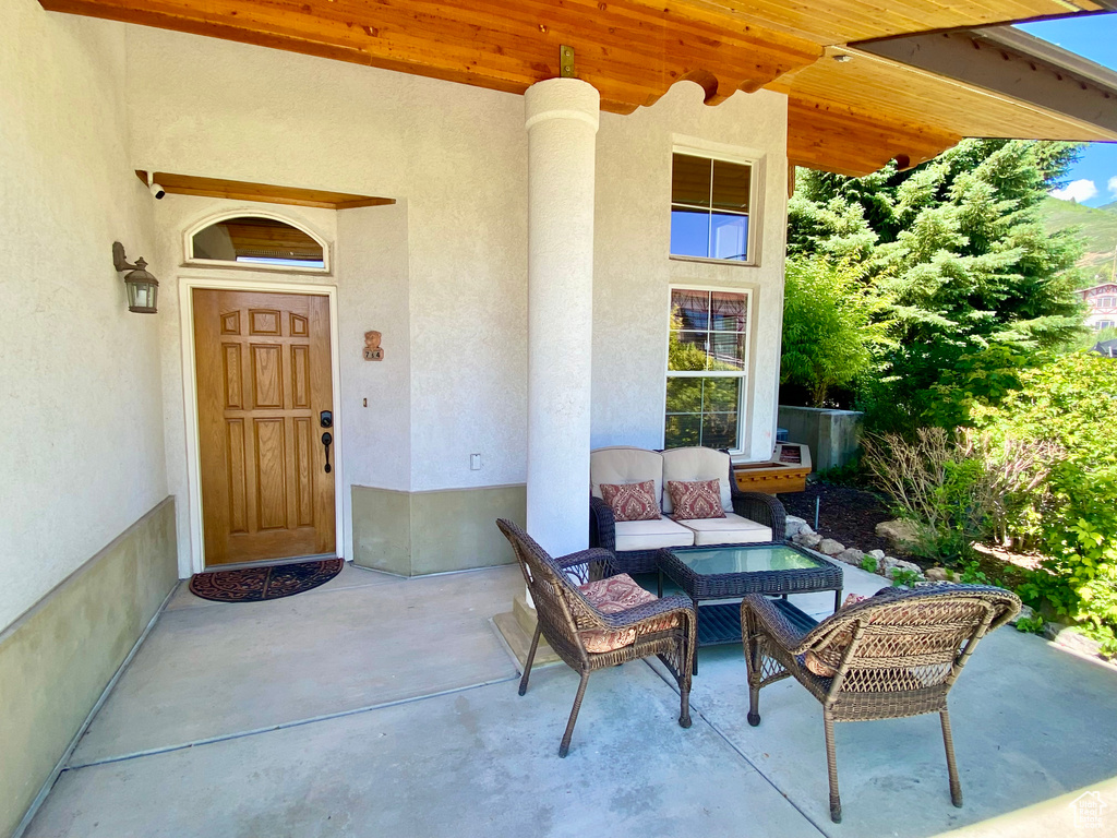 Exterior space with an outdoor living space and a patio area