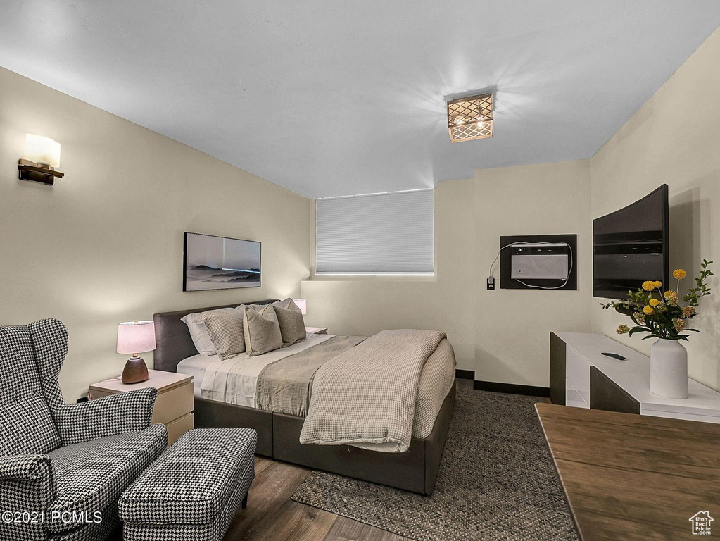 Bedroom featuring dark hardwood / wood-style flooring