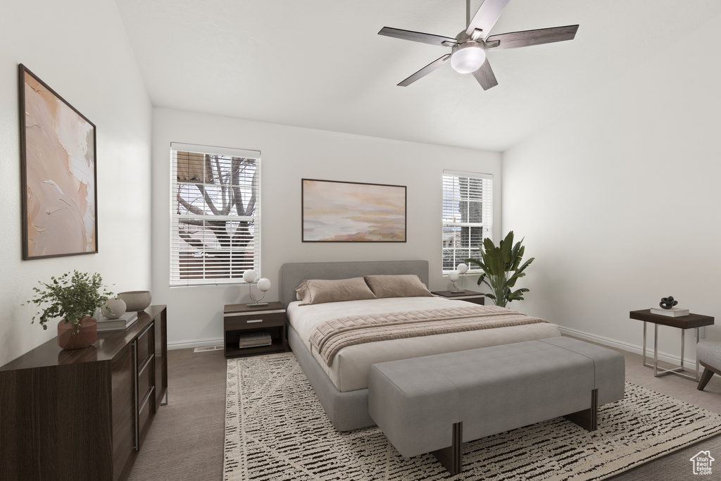 Bedroom featuring baseboards, light carpet, lofted ceiling, and a ceiling fan