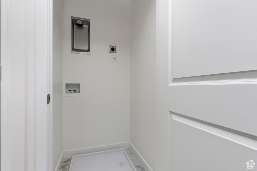 Washroom with hookup for an electric dryer and washer hookup