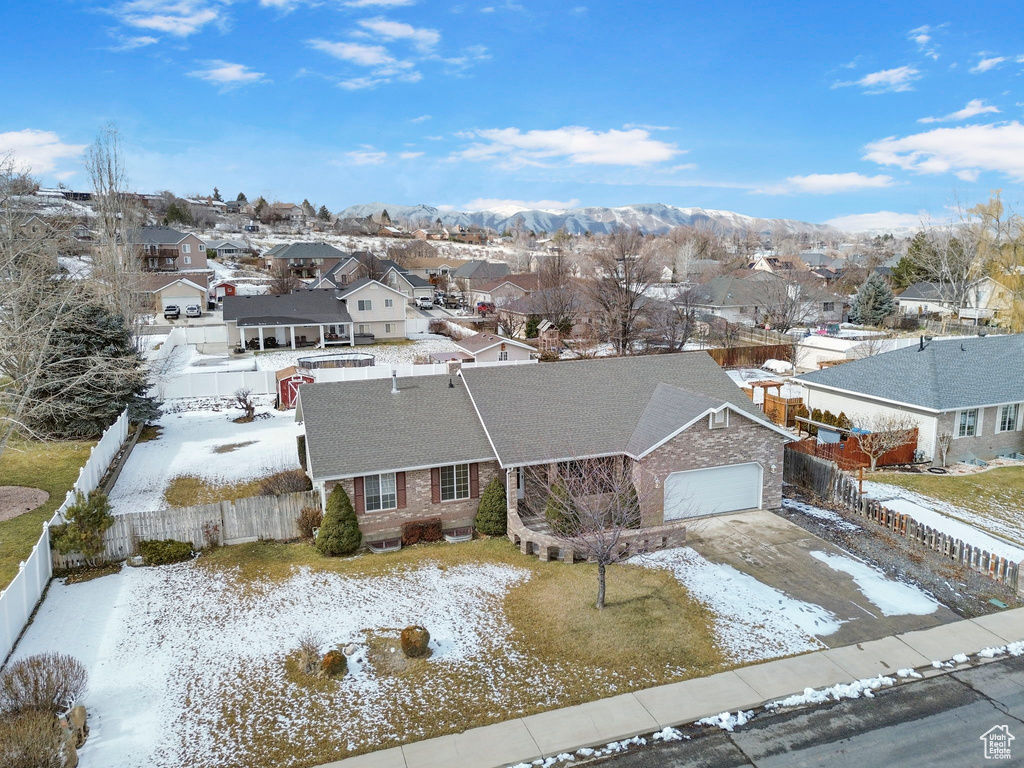 Snowy aerial view featuring a mountain view