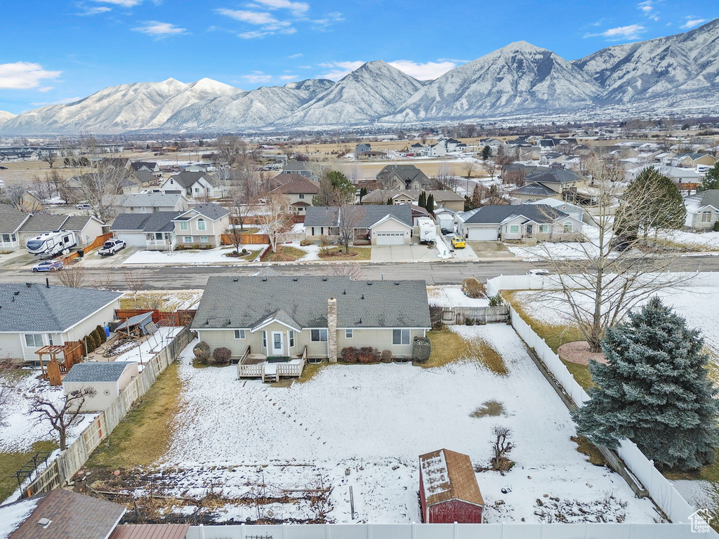 Snowy aerial view featuring a mountain view