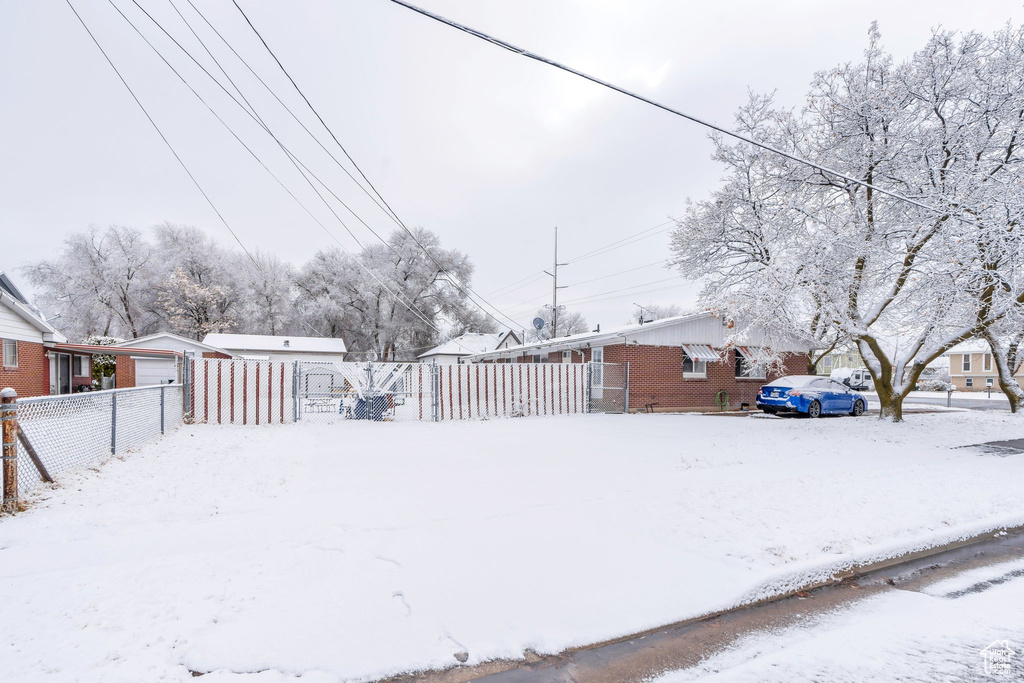 View of yard covered in snow