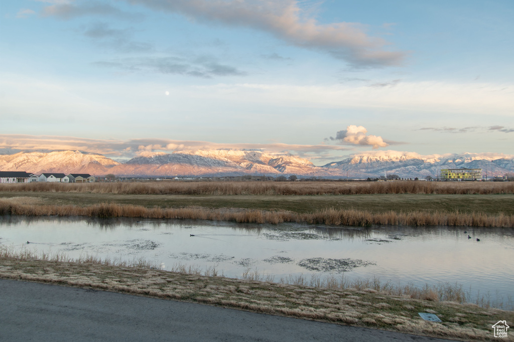 View of water feature with a mountain view