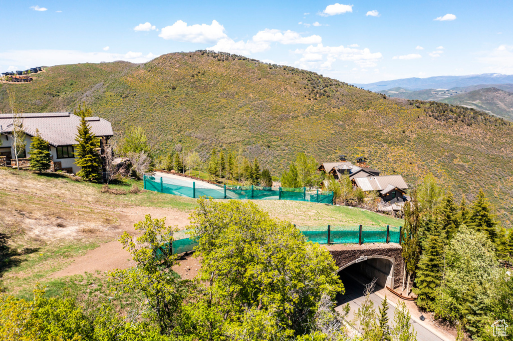 Aerial view of a pool and a mountain backdrop
