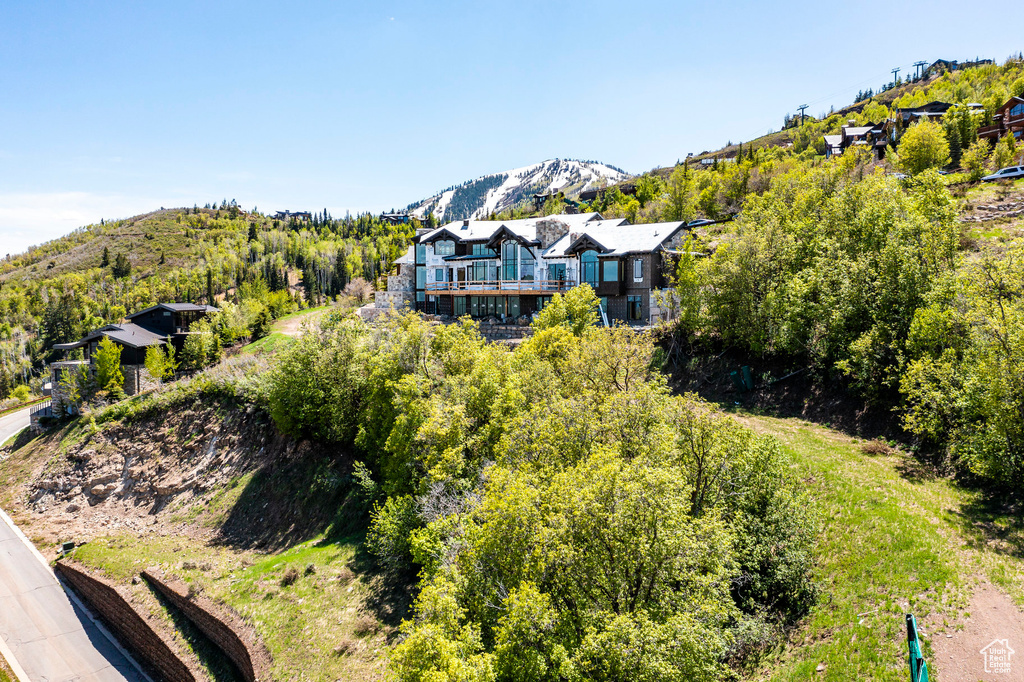 View of subject property featuring mountains