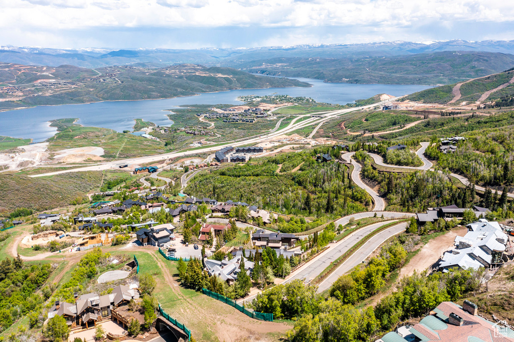 Aerial overview of property's location with a water and mountain view