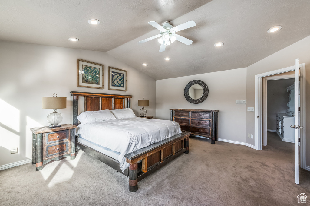Bedroom featuring light colored carpet, vaulted ceiling, baseboards, recessed lighting, and ceiling fan