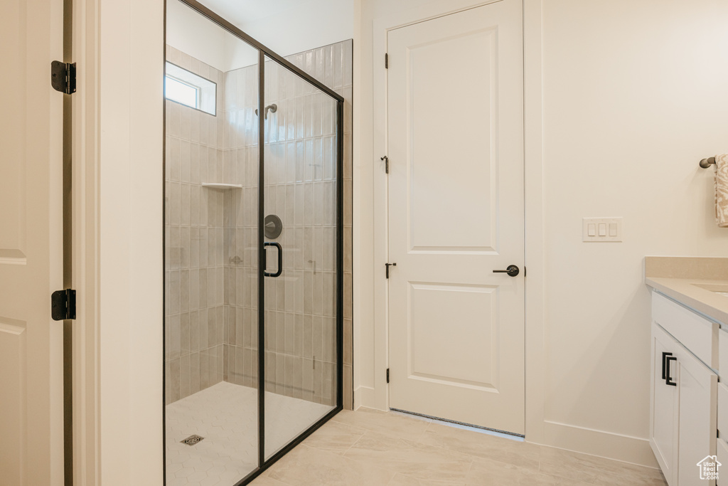 Bathroom with vanity and a shower stall