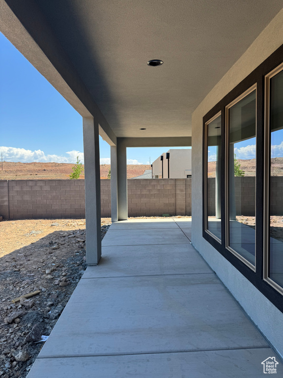 Fenced backyard with a patio